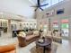 Bright living room with cathedral ceilings, open to the kitchen, complete with tile floors and lots of windows at 4334 Tolkien St, Orlando, FL 32828
