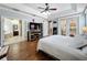 This main bedroom has hardwood floors, french doors, and easy access to the main bathroom at 4334 Tolkien St, Orlando, FL 32828