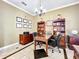 Spacious office featuring classic wooden furniture, tile floors, and window shutters at 4334 Tolkien St, Orlando, FL 32828