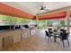 Outdoor kitchen featuring grill and countertop area with an adjacent patio seating area at 4334 Tolkien St, Orlando, FL 32828