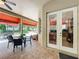Covered patio featuring outdoor seating area with access to the home's interior and backyard at 4334 Tolkien St, Orlando, FL 32828