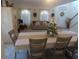View of dining area featuring modern decor, neutral colors, and an open living room space at 4531 Se 30Th St, Ocala, FL 34480