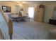 View of dining area from entryway, featuring modern decor, neutral colors, and a mix of tile and carpet at 4531 Se 30Th St, Ocala, FL 34480