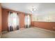 A large living room featuring natural light with neutral colored carpeting at 4531 Se 30Th St, Ocala, FL 34480