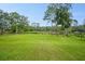 Expansive backyard with a view of mature trees and a picturesque landscape at 5531 Marys Villa Rd, Groveland, FL 34736