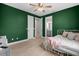 A stylish bedroom features a view into the bathroom, light-colored floors and white dresser at 5531 Marys Villa Rd, Groveland, FL 34736