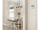 Dining area with view and stylish light fixture at 5531 Marys Villa Rd, Groveland, FL 34736