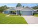 Charming single-story home featuring a well-maintained lawn and a two-car garage, perfect for suburban living at 5531 Marys Villa Rd, Groveland, FL 34736
