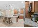Modern kitchen featuring a granite island, stainless steel appliances and wooden cabinets at 5531 Marys Villa Rd, Groveland, FL 34736