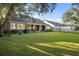 Spacious, well-maintained backyard with lush green lawn and exterior view of the home at 6047 Blakeford Dr, Windermere, FL 34786