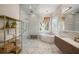 Bathroom featuring a soaking tub, glass shower, and a wood vanity at 6047 Blakeford Dr, Windermere, FL 34786