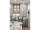 Elegant kitchen with gray cabinets, stainless steel appliances, and a stylish pendant light at 6047 Blakeford Dr, Windermere, FL 34786