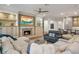 Elegant living room featuring a fireplace, custom built-ins, and stylish, comfortable seating at 6047 Blakeford Dr, Windermere, FL 34786