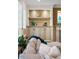 Cozy living room featuring a built-in cabinet, shelves, and a decorative fireplace at 6047 Blakeford Dr, Windermere, FL 34786