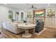 Elegant living room featuring a fireplace, custom built-ins, and stylish, comfortable seating at 6047 Blakeford Dr, Windermere, FL 34786