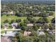 Aerial view showcasing a neighborhood with mature trees, spacious yards, and well-maintained homes at 636 Cheviot Ct, Apopka, FL 32712