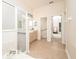 A bathroom with neutral tile, an updated sink vanity, and a step-in shower at 636 Cheviot Ct, Apopka, FL 32712