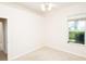 Neutral bedroom features carpet and a window to the outdoors at 636 Cheviot Ct, Apopka, FL 32712