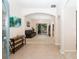 Open foyer with tile flooring, an arched entryway, and a view into the spacious living room at 636 Cheviot Ct, Apopka, FL 32712