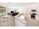 Open kitchen with granite countertops, stainless steel appliances, and a breakfast nook area at 636 Cheviot Ct, Apopka, FL 32712