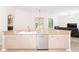 Spacious kitchen with a peninsula countertop, stylish cabinetry, and stainless steel dishwasher at 636 Cheviot Ct, Apopka, FL 32712