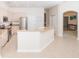 Bright kitchen with a breakfast bar, modern appliances, and seamless flow to living spaces at 636 Cheviot Ct, Apopka, FL 32712