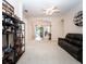 Bright, open-concept living area with neutral carpet, archways, and ample natural light at 636 Cheviot Ct, Apopka, FL 32712