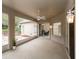 This is an ample screened-in patio with a ceiling fan, tile floors, and access to the backyard at 636 Cheviot Ct, Apopka, FL 32712