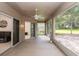 This is an ample screened-in patio with a ceiling fan, tile floors, and access to the backyard at 636 Cheviot Ct, Apopka, FL 32712