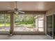 Relaxing screened patio showing beautiful backyard view with lush landscaping at 636 Cheviot Ct, Apopka, FL 32712