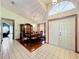 Elegant dining room with a chandelier, hardwood floors, and views of the living area at 6970 Knightswood Dr, Orlando, FL 32818
