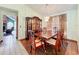 Spacious dining room featuring a large china cabinet, dining table, and chandelier at 6970 Knightswood Dr, Orlando, FL 32818