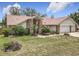 Charming single-story home with brick accents and mature landscaping in a quiet residential neighborhood at 6970 Knightswood Dr, Orlando, FL 32818