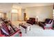 Elegant living room with a high ceiling, comfortable seating, and neutral tones for a sophisticated feel at 6970 Knightswood Dr, Orlando, FL 32818