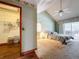 Spacious main bedroom with vaulted ceiling, carpet, and access to a private patio at 6970 Knightswood Dr, Orlando, FL 32818