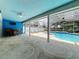 Charming covered patio with outdoor seating overlooking a refreshing pool area at 6970 Knightswood Dr, Orlando, FL 32818