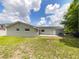 Spacious backyard with a patio, perfect for outdoor entertaining and relaxation at 7040 Hennepin Blvd, Orlando, FL 32818