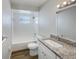 Well-lit bathroom featuring a granite vanity, tiled shower and tub with modern fixtures at 7040 Hennepin Blvd, Orlando, FL 32818