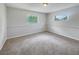 Cozy bedroom with carpet and two windows, freshly painted at 7040 Hennepin Blvd, Orlando, FL 32818