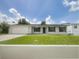 Charming single-story home with a well-manicured lawn, attached garage and a cozy front entrance at 7040 Hennepin Blvd, Orlando, FL 32818