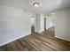 Bright living room featuring laminate flooring and fresh, neutral paint at 7040 Hennepin Blvd, Orlando, FL 32818