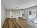 Open floorplan: Living room with kitchen view and sliding door access at 7040 Hennepin Blvd, Orlando, FL 32818