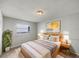 Cozy bedroom featuring a comfortable bed, warm lighting, and elegant decor at 7040 Hennepin Blvd, Orlando, FL 32818