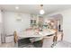 Bright dining room featuring a modern table and chairs, adjacent to kitchen at 7102 Easter St, Winter Park, FL 32792