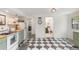 Well-lit kitchen with stylish cabinets and modern appliances, connecting to other rooms at 7102 Easter St, Winter Park, FL 32792