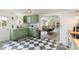 Well-lit kitchen with stylish cabinets and modern appliances, connecting to the dining area at 7102 Easter St, Winter Park, FL 32792