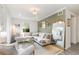 Inviting living room with stylish decor, comfortable seating, and natural light at 7102 Easter St, Winter Park, FL 32792
