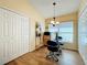 Cozy breakfast nook featuring a glass table set, a window with blinds, and two closets at 748 Andover Cir, Winter Springs, FL 32708