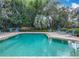 Enjoy a refreshing dip in this community pool with a lush, green backdrop at 748 Andover Cir, Winter Springs, FL 32708