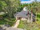 Exterior of the community building set amongst landscaped trees, shrubs and foliage at 748 Andover Cir, Winter Springs, FL 32708